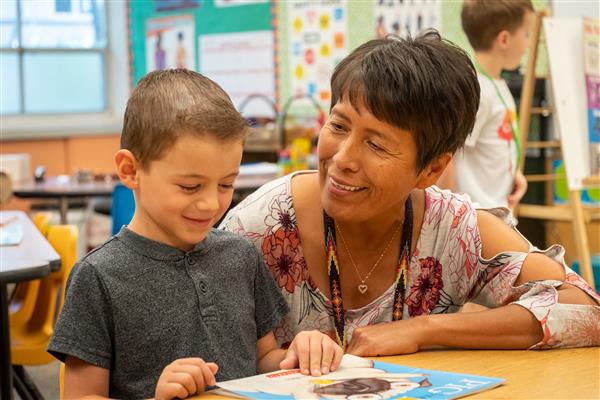 Teacher working with Student